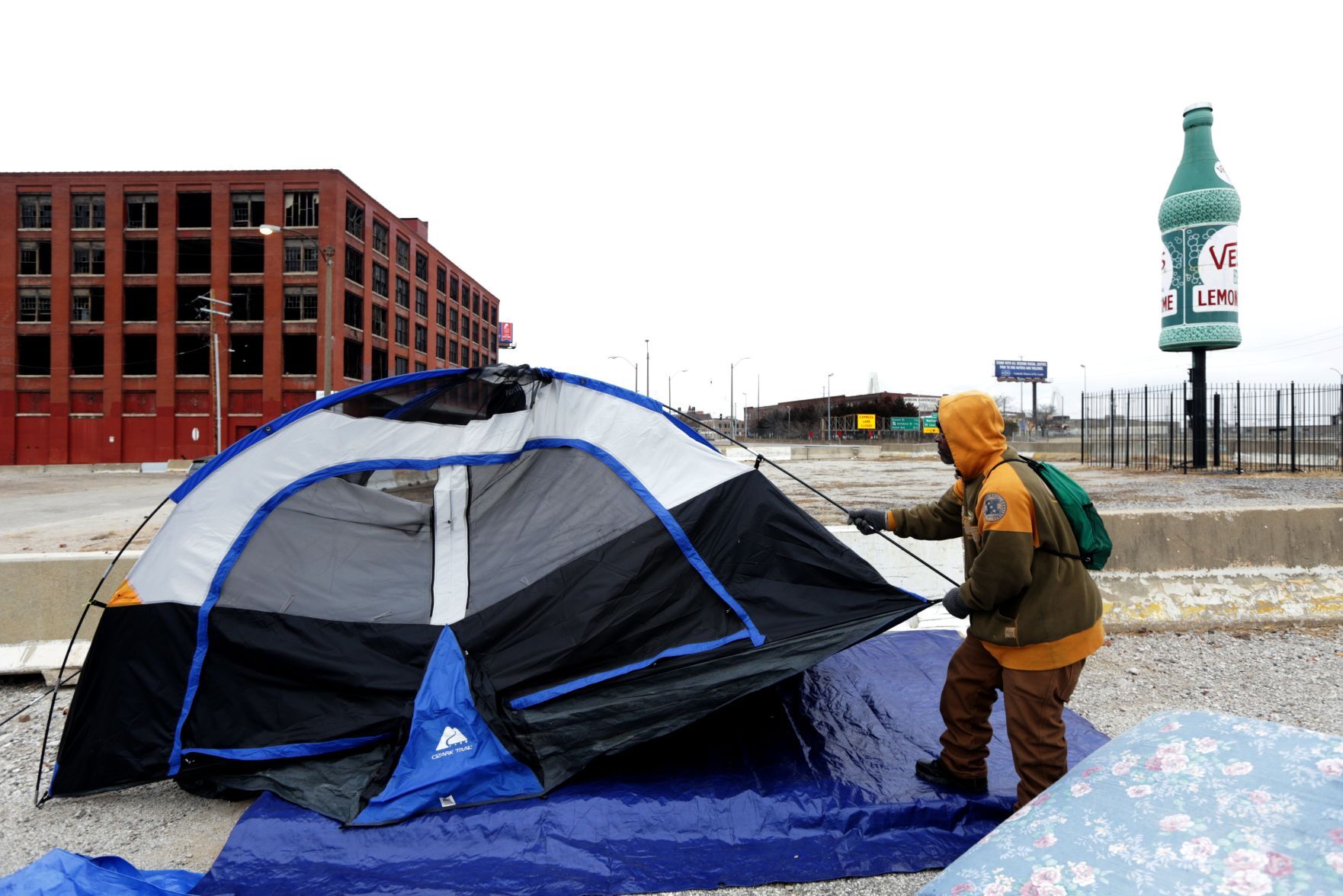 Tent encampment outside vacant McGuire Moving & Storage building